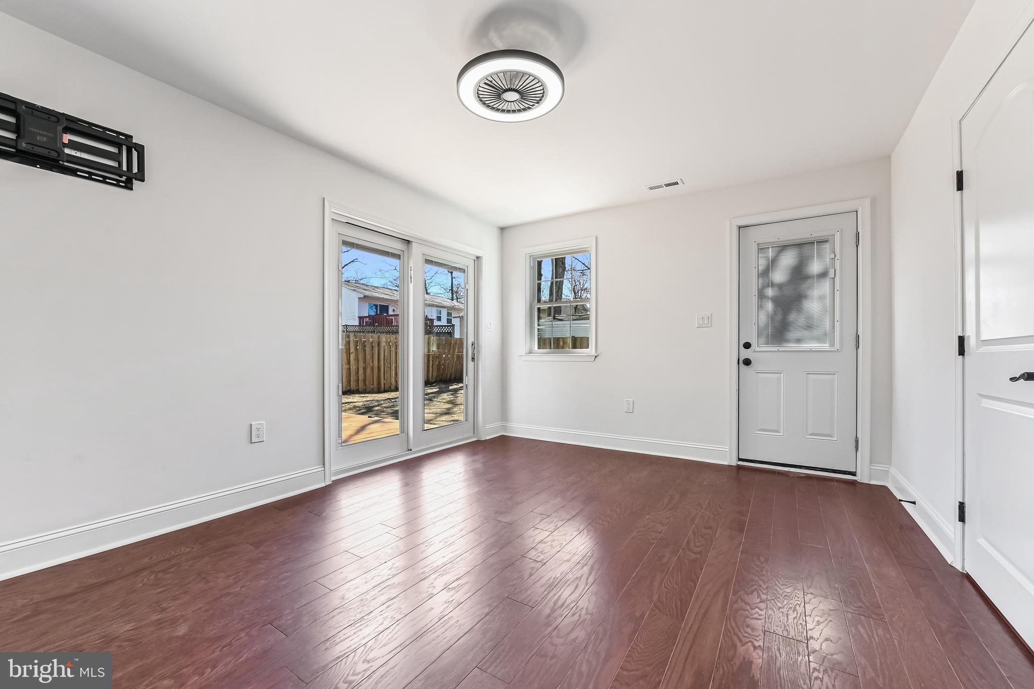 1637 Fairhill Drive Edgewater, MD 21037 - Photo 17 of 46 an empty room with wooden floor and windows