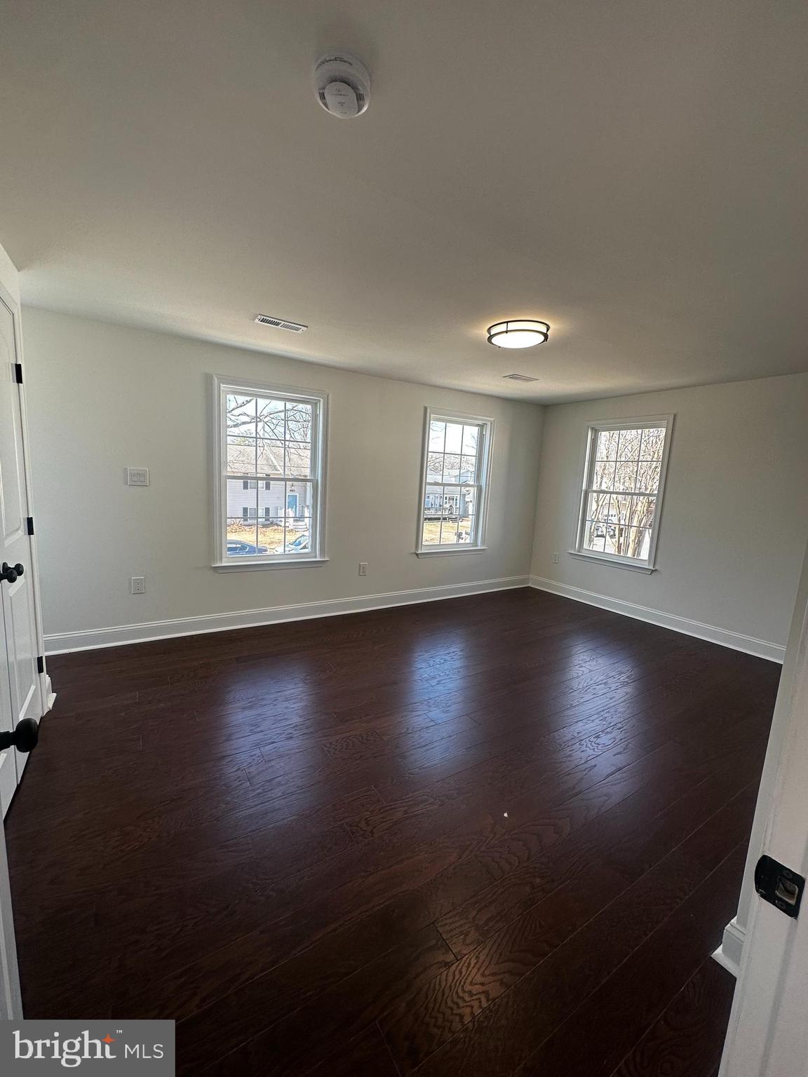 1637 Fairhill Drive Edgewater, MD 21037 - Photo 21 of 46 a view of an empty room with wooden floor and a window