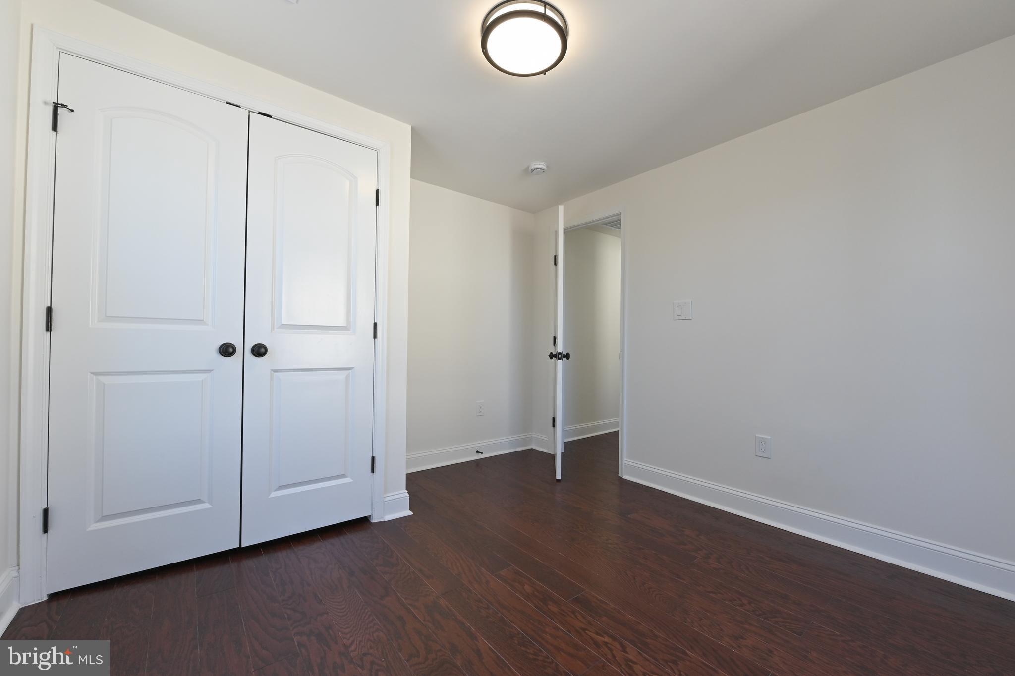 1637 Fairhill Drive Edgewater, MD 21037 - Photo 26 of 46 an empty room with wooden floor and closet