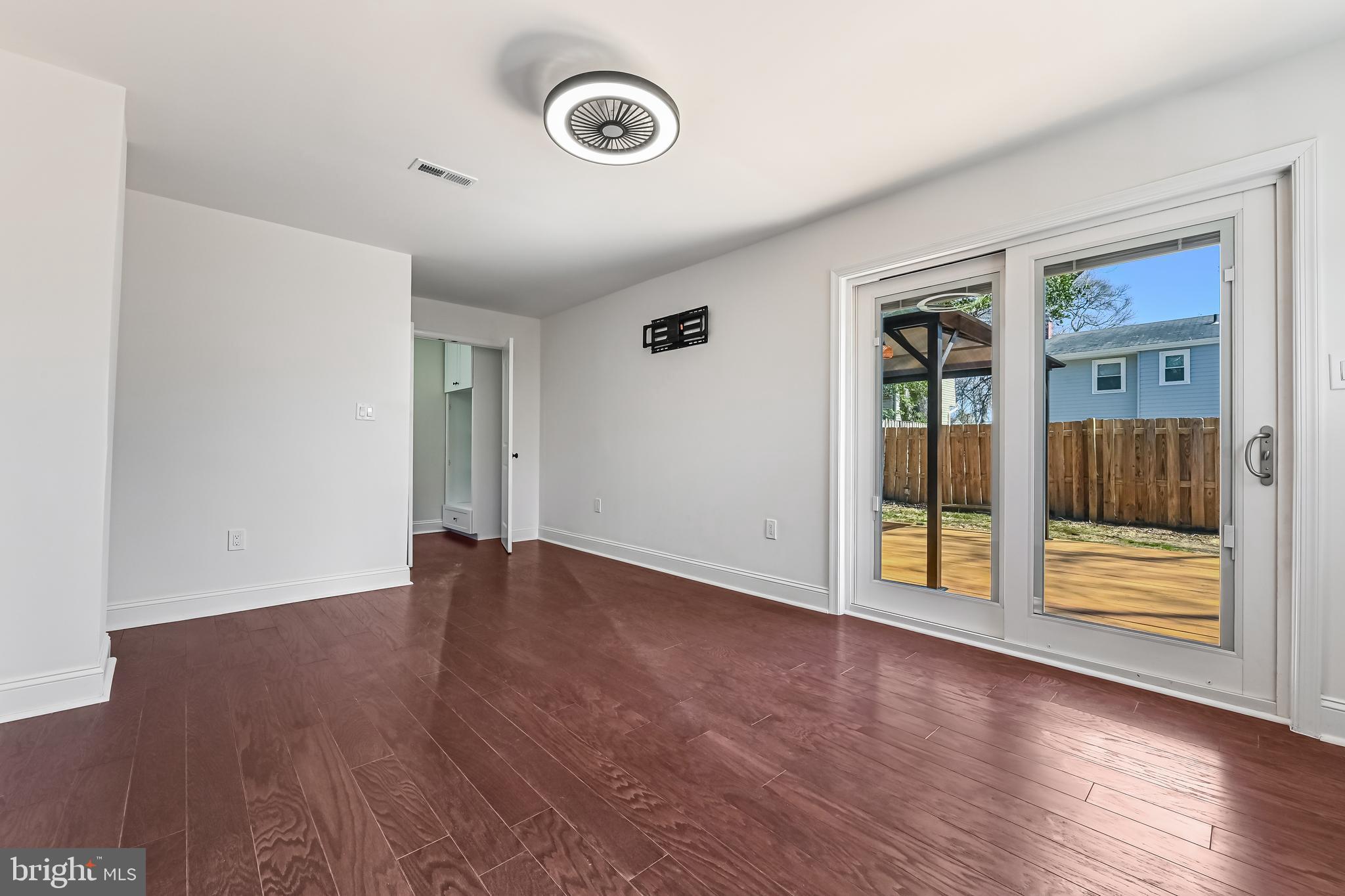 1637 Fairhill Drive Edgewater, MD 21037 - Photo 29 of 46 an empty room with wooden floor and windows