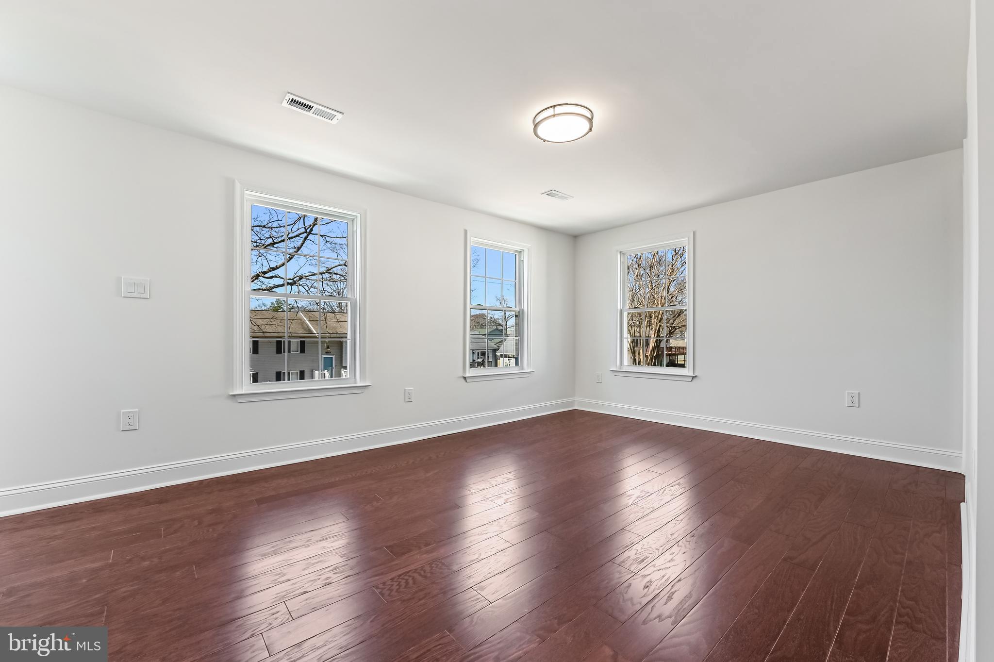 1637 Fairhill Drive Edgewater, MD 21037 - Photo 30 of 46 a view of an empty room with wooden floor and a window