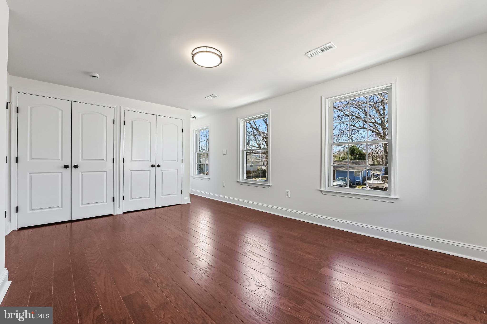 1637 Fairhill Drive Edgewater, MD 21037 - Photo 31 of 46 a view of an empty room with wooden floor and a window