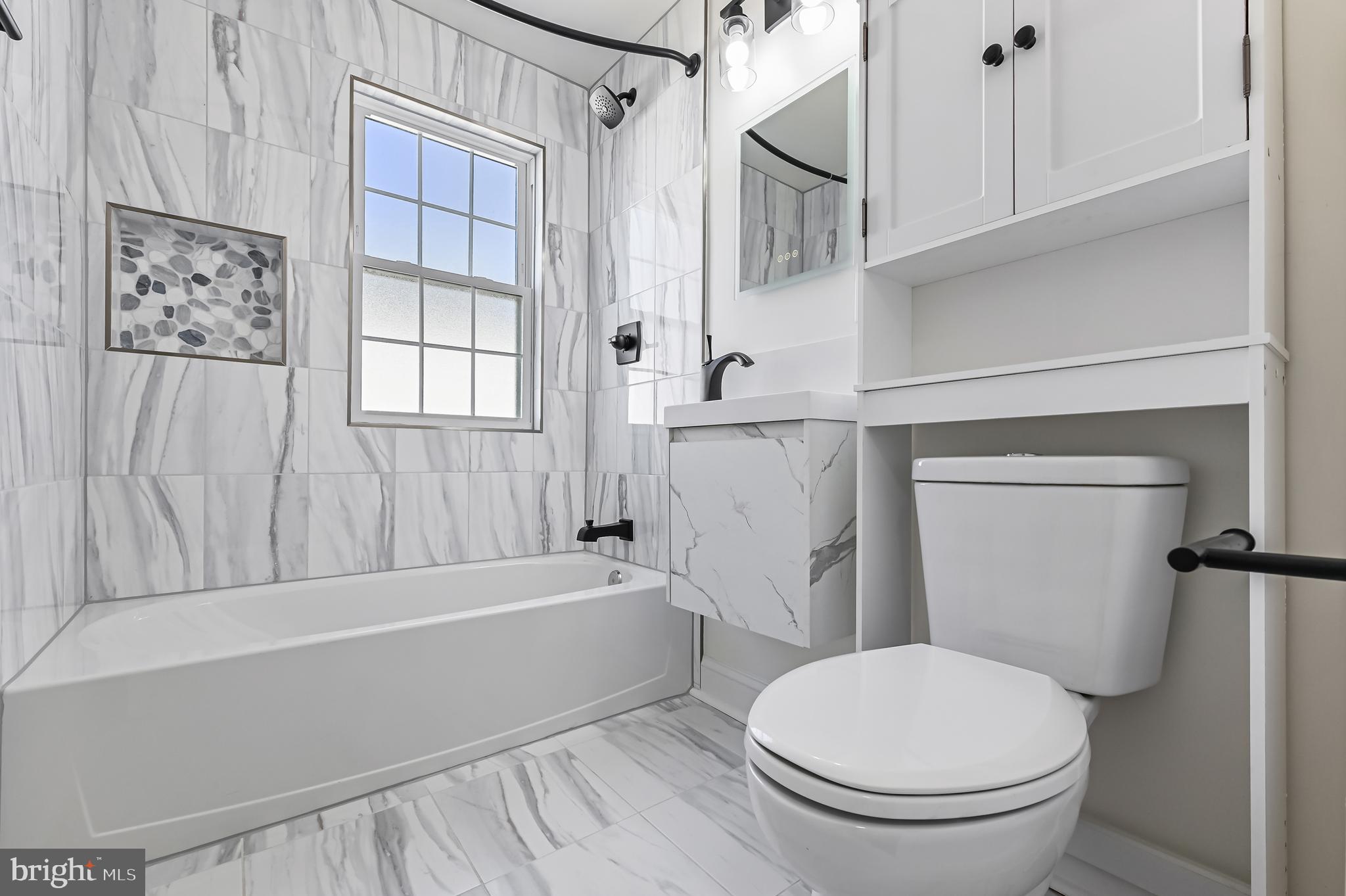 1637 Fairhill Drive Edgewater, MD 21037 - Photo 35 of 46 a white toilet sitting next to a bathroom sink