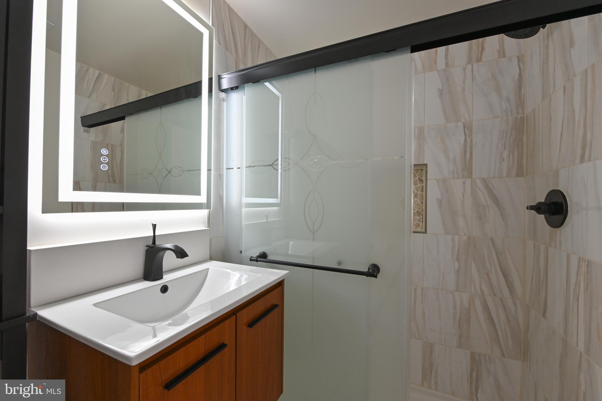 1637 Fairhill Drive Edgewater, MD 21037 - Photo 36 of 46 a bathroom with a sink and mirror