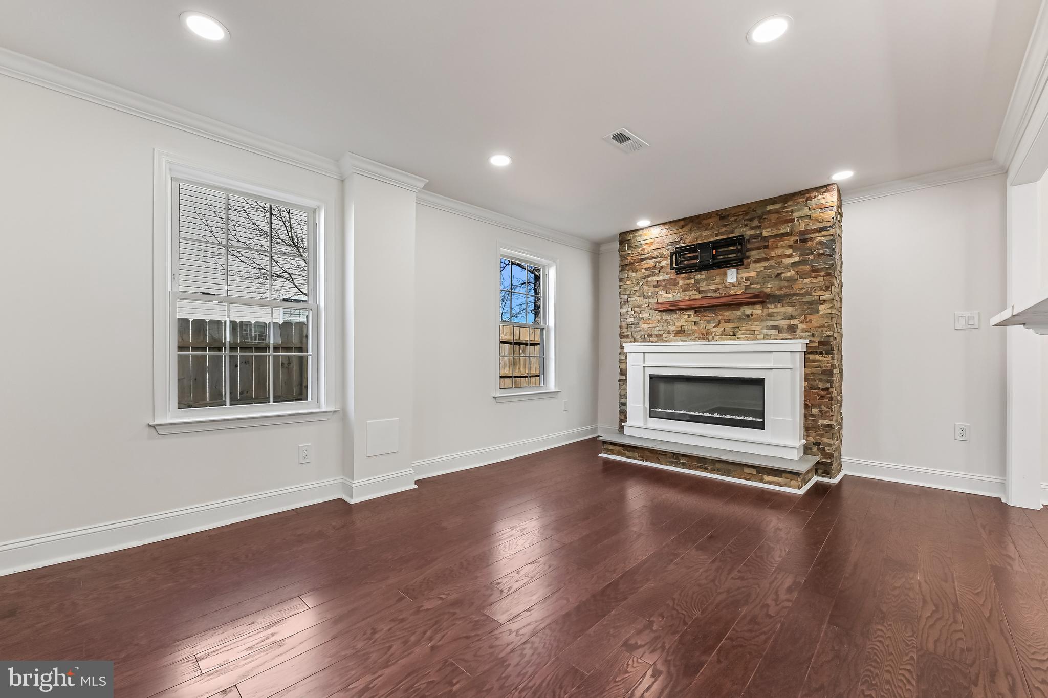 1637 Fairhill Drive Edgewater, MD 21037 - Photo 4 of 46 a view of an empty room with wooden floor fireplace and a window