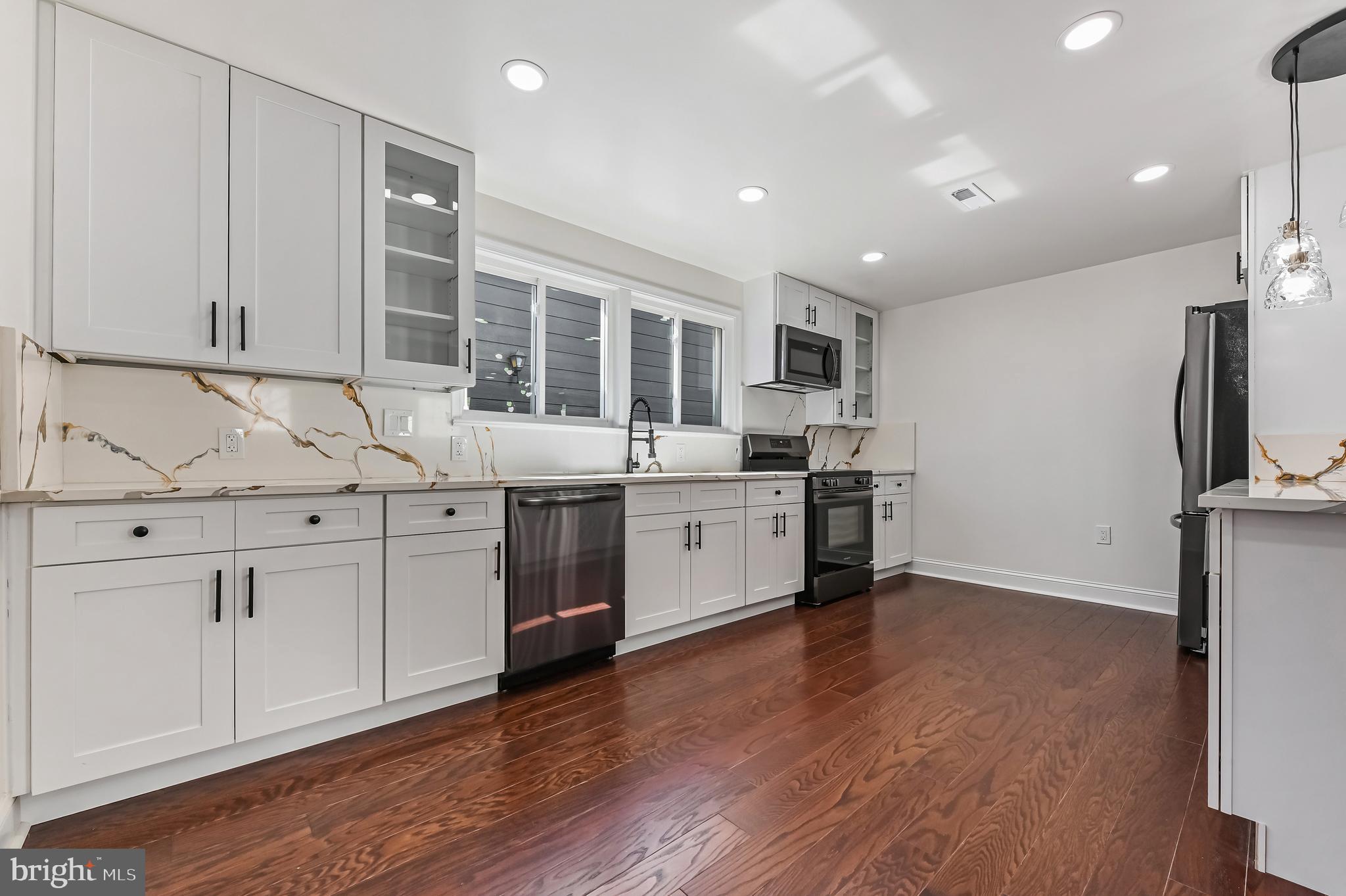 1637 Fairhill Drive Edgewater, MD 21037 - Photo 7 of 46 a kitchen with stainless steel appliances granite countertop a sink a stove and a refrigerator
