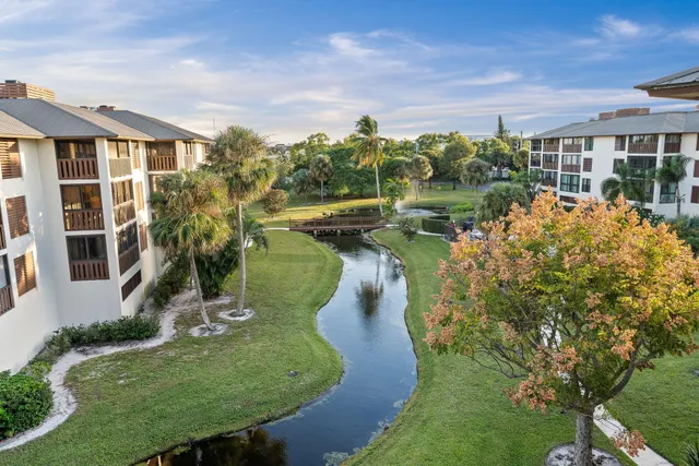 a view of a house with a yard and plants