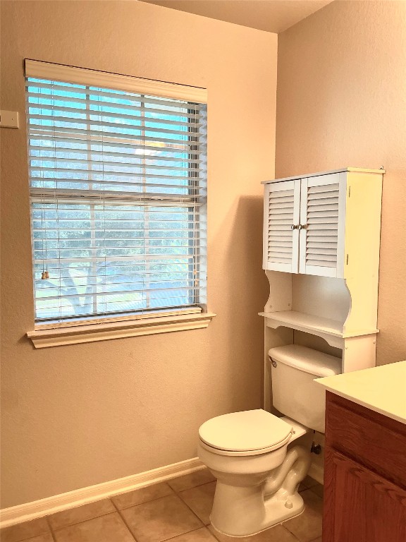 13500 Oregon Flat Trail Austin, TX 78727 - Photo 14 of 23 a bathroom with a toilet a sink and a window