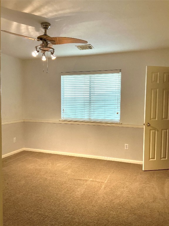 13500 Oregon Flat Trail Austin, TX 78727 - Photo 16 of 23 a view of a room with a ceiling fan and window