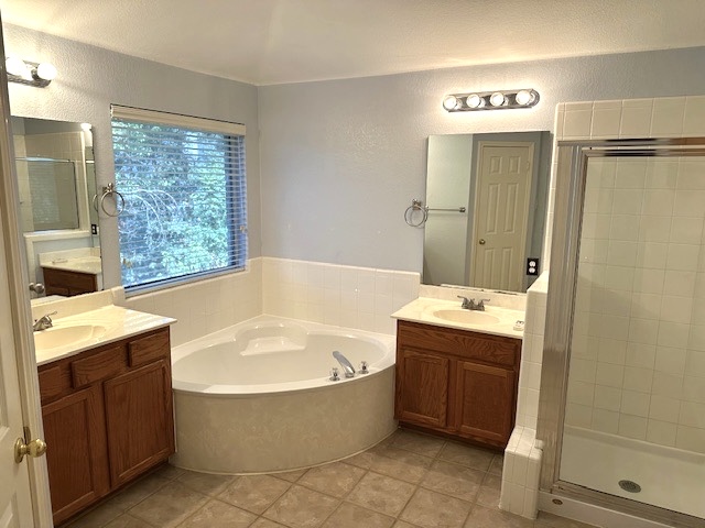 13500 Oregon Flat Trail Austin, TX 78727 - Photo 18 of 23 a spacious bathroom with a tub sink and mirror
