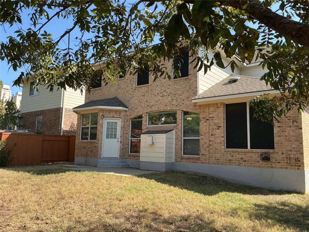 13500 Oregon Flat Trail Austin, TX 78727 - Photo 20 of 23 a front view of a house with a yard