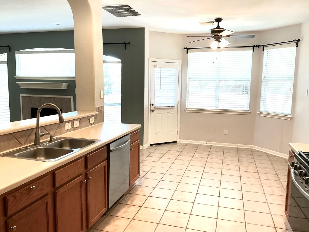 13500 Oregon Flat Trail Austin, TX 78727 - Photo 5 of 23 a kitchen with a sink a window and cabinets
