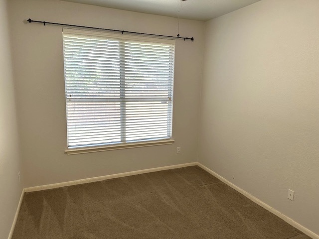 13500 Oregon Flat Trail Austin, TX 78727 - Photo 9 of 23 an empty room with a window
