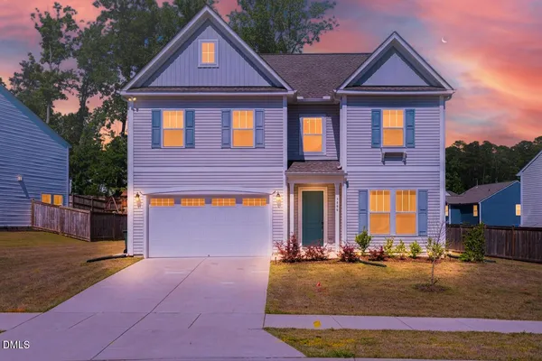 a front view of a house with yard