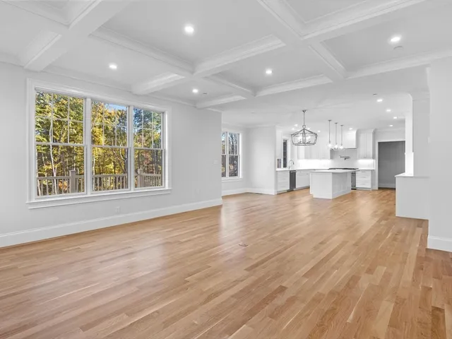a view of kitchen with wooden floor and windows