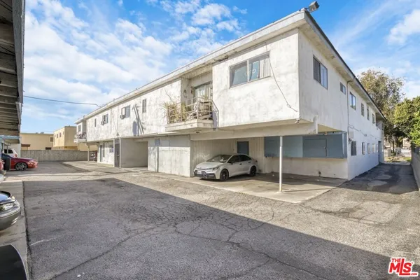 a view of a car park in front of house