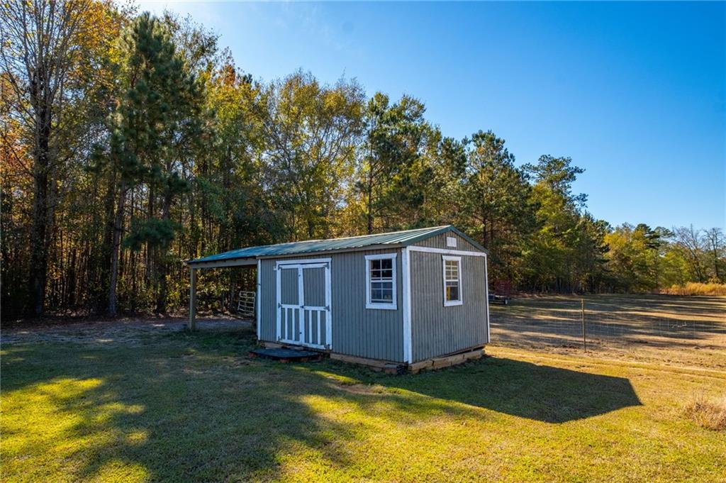 230 Mt Pleasant Road Hampton, GA 30228 - Photo 20 of 51 a view of a house with backyard and sitting area