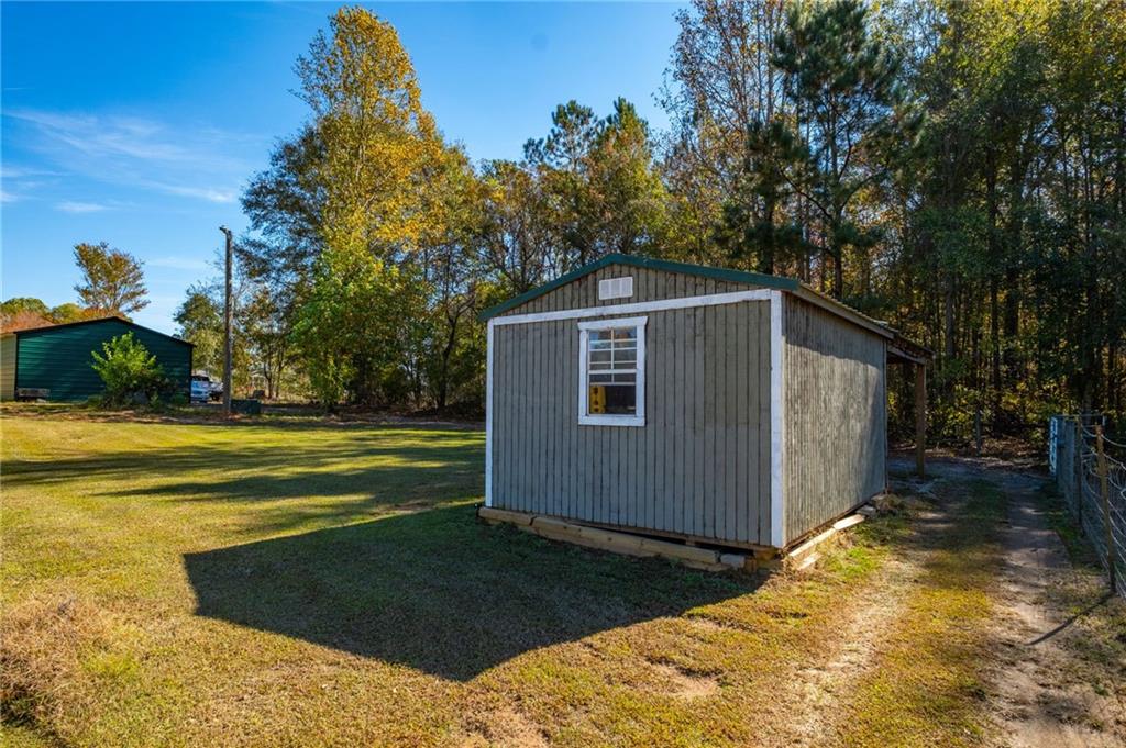 230 Mt Pleasant Road Hampton, GA 30228 - Photo 21 of 51 a view of a house with a yard