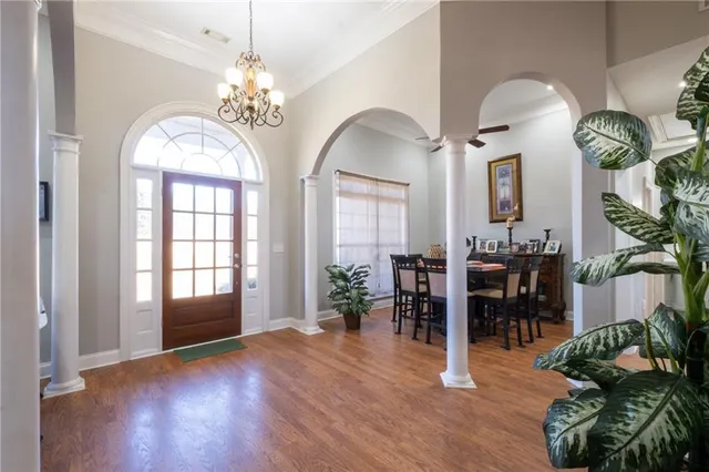 a view of a dining room with furniture window and wooden floor
