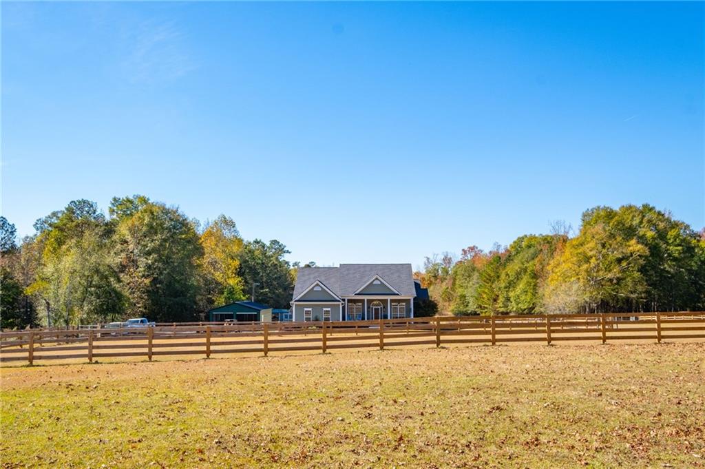 230 Mt Pleasant Road Hampton, GA 30228 - Photo 3 of 51 a view of a swimming pool with an outdoor seating