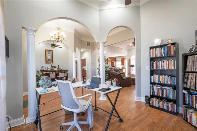 a view of a dining room with furniture and wooden floor