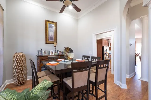 a view of a dining room with furniture window and wooden floor