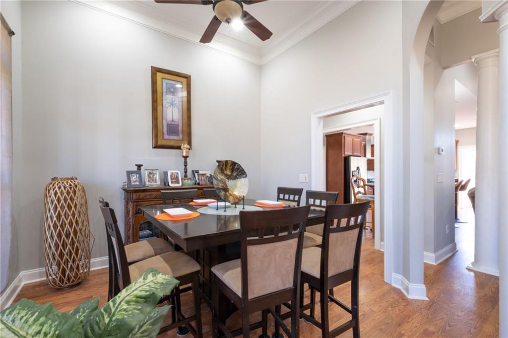 230 Mt Pleasant Road Hampton, GA 30228 - Photo 33 of 51 a view of a dining room with furniture and wooden floor