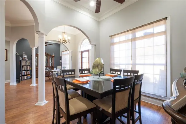 a view of a dining room with furniture and wooden floor