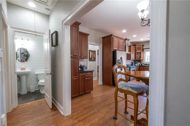 a living room with furniture a large window and appliances