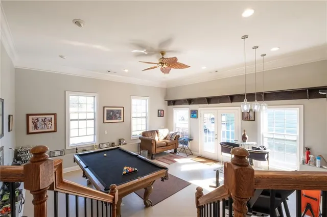 a living room with furniture a rug and a window
