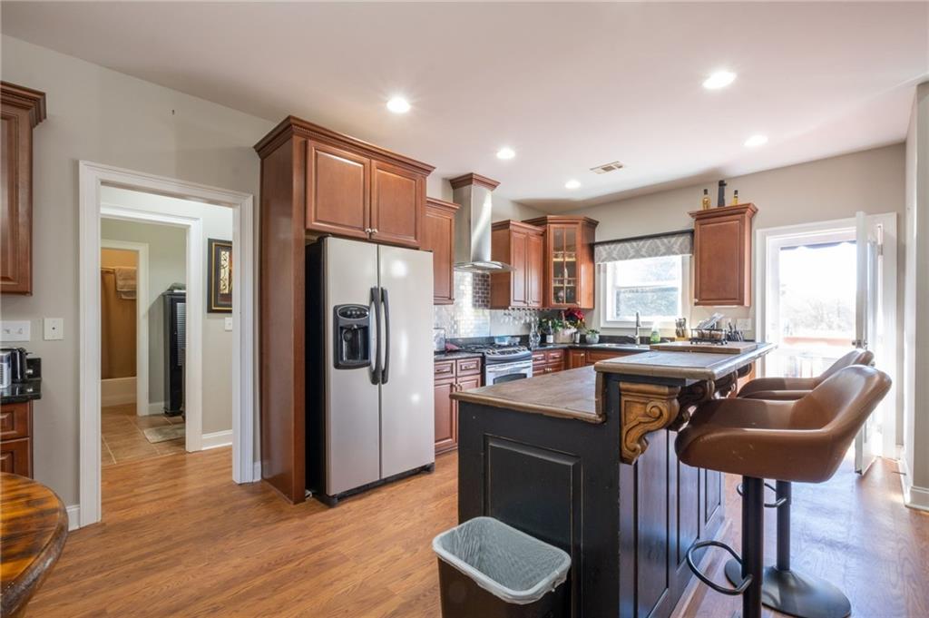 230 Mt Pleasant Road Hampton, GA 30228 - Photo 42 of 51 a kitchen with stainless steel appliances granite countertop counter space a refrigerator and a sink