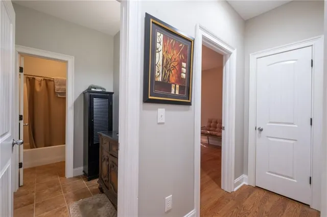 a bedroom with a bed couch and a ceiling fan