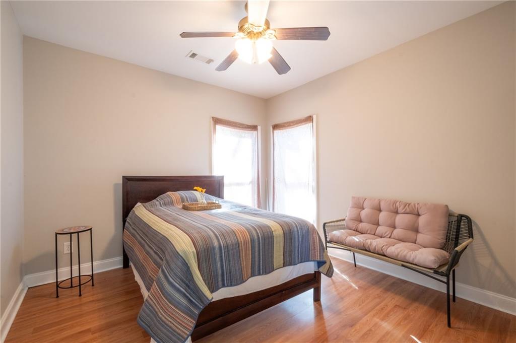 230 Mt Pleasant Road Hampton, GA 30228 - Photo 47 of 51 a bedroom with a bed couch and a ceiling fan