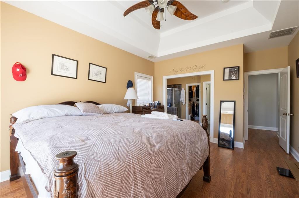 230 Mt Pleasant Road Hampton, GA 30228 - Photo 51 of 51 a bedroom with a bed and a chandelier