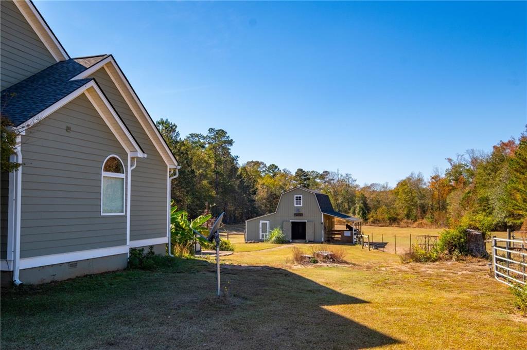 230 Mt Pleasant Road Hampton, GA 30228 - Photo 6 of 51 a view of a house with basketball court