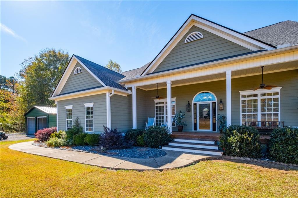 230 Mt Pleasant Road Hampton, GA 30228 - Photo 7 of 51 a front view of a house with a yard