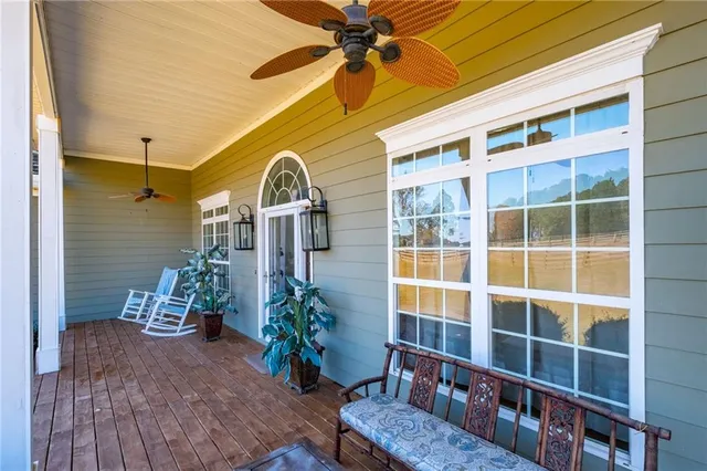a front view of a house with outdoor seating and plants