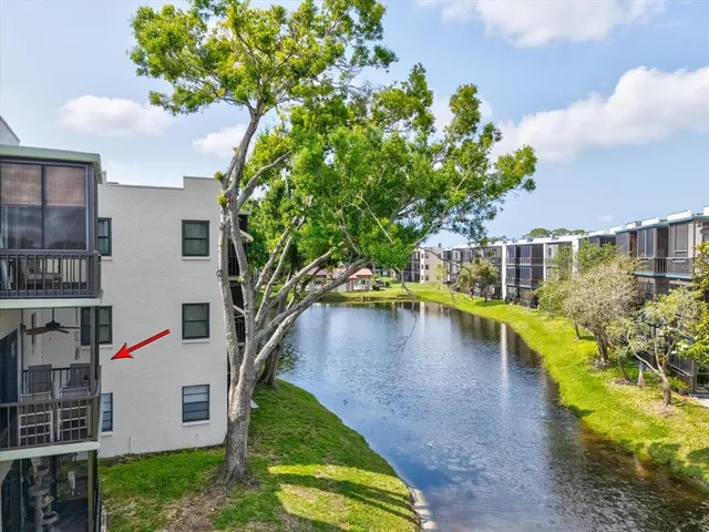 a view of swimming pool with outdoor seating and garden