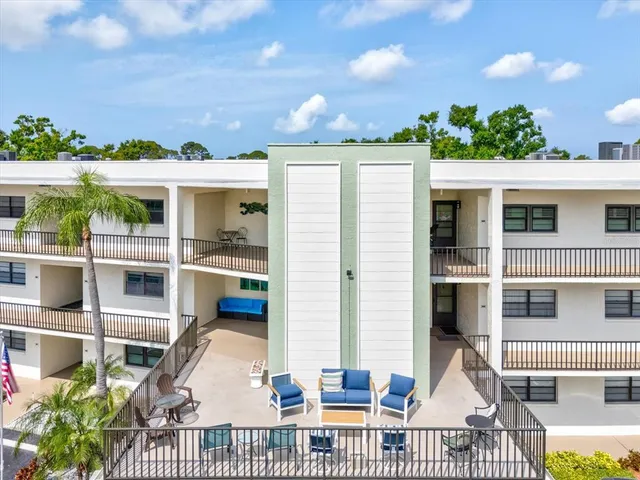 an aerial view of a house with a yard and garden
