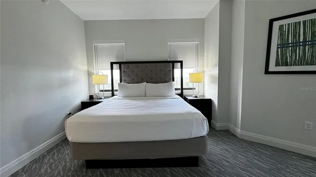 a bedroom with a bed and window