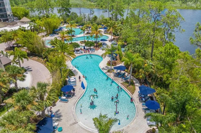 an aerial view of a residential houses with outdoor space