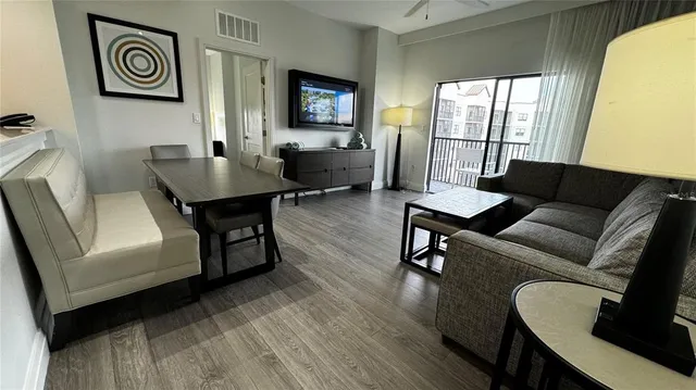 a living room with furniture and a window