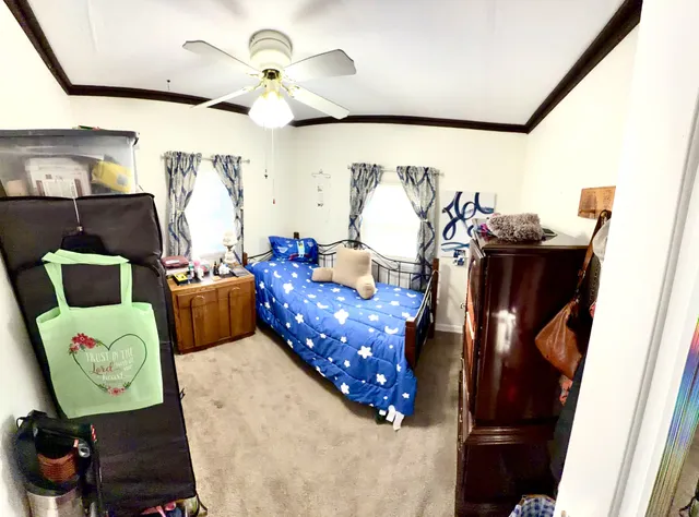 a bedroom with furniture and a chair