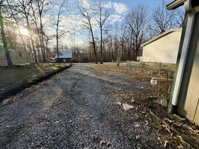 a view of open space with yard