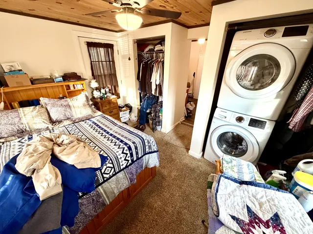 a bedroom with furniture and a window