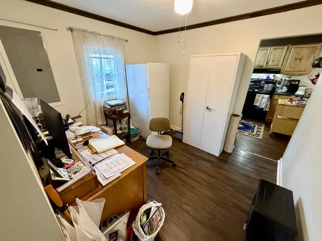 a view of a workspace with furniture and toys