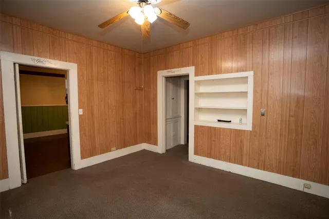 a view of an empty room with a closet