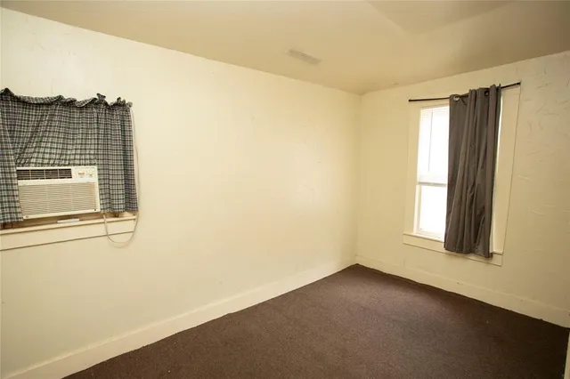 a view of empty room with windows