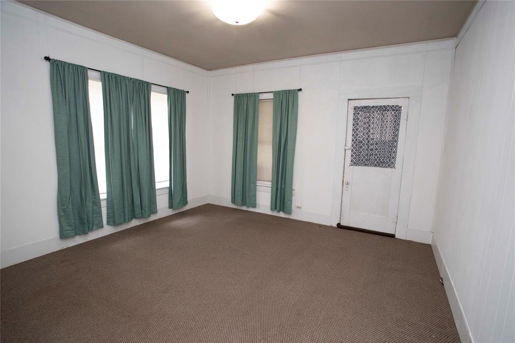 1311 Loving Highway Graham, TX 76450 - Photo 16 of 31 an empty room with windows