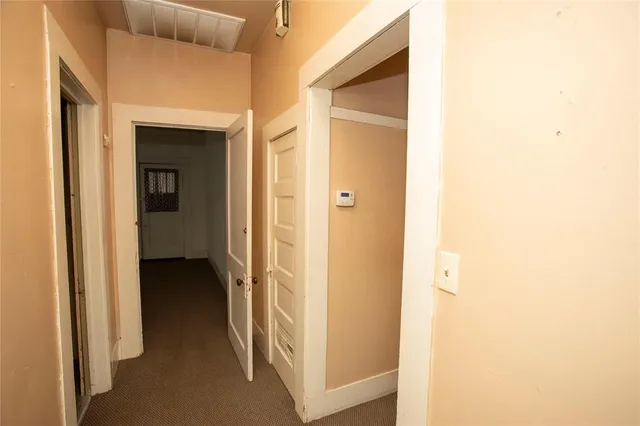 a view of a bathroom from a hallway
